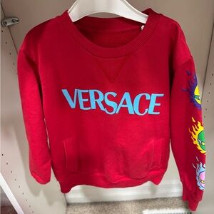 Versace long sleeve shirt for boys. Size is 5T and the color is red and blue.